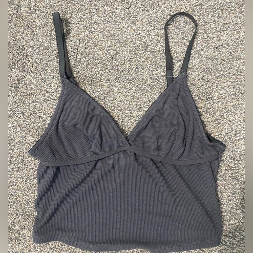 Grey loose fitting tank top, with adjustable straps.